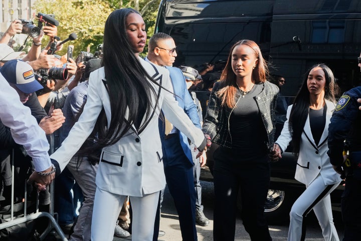 Three of Combs' seven children, Chance Combs, D'lila Combs and Jessie Combs, form a chain outside the courthouse before his sentencing.