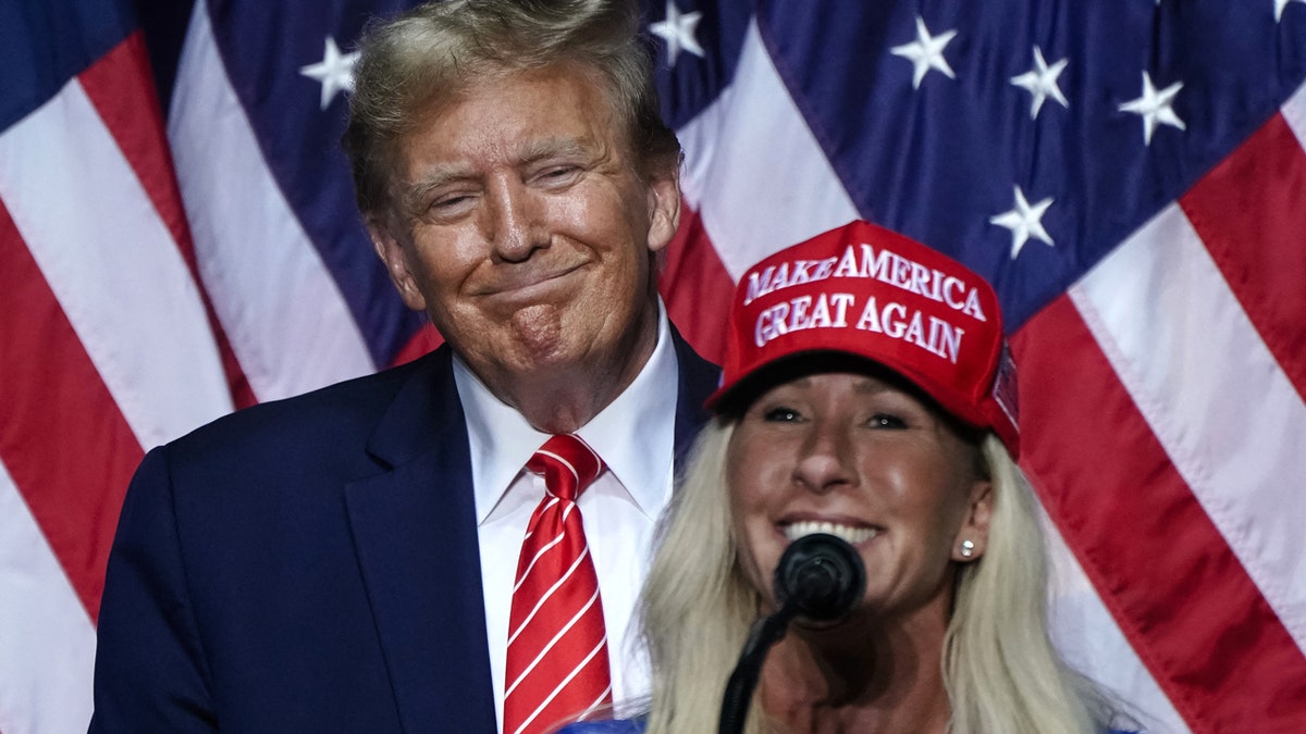 Trump and MTG during a campaign rally
